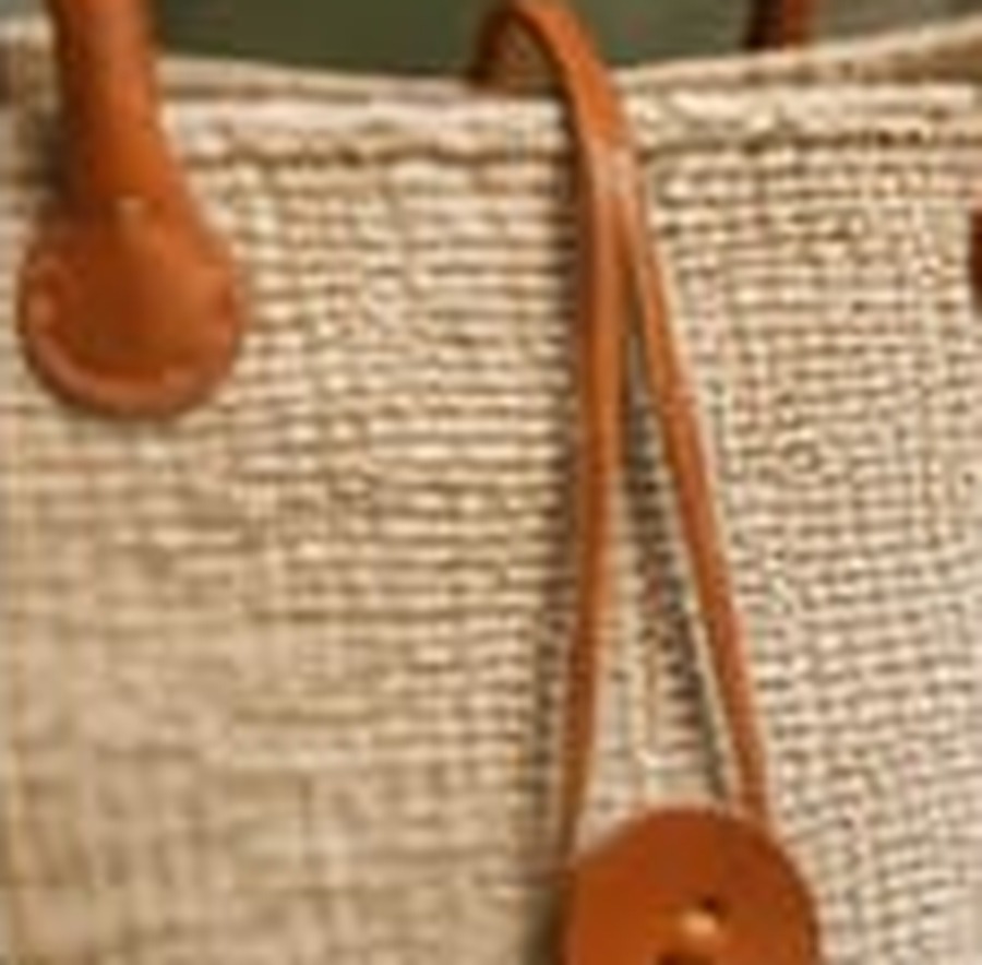 Handwoven sisal tote detail, leather stitching